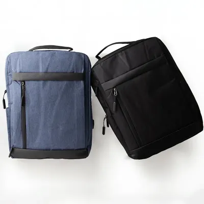 Mochila de nylon 21 litros com detalhe em couro sintético, três compartimentos, sendo o principal com bolso para notebook 15,6